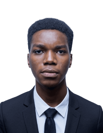 Portrait of Aime Ndayambaje in a dark suit, white shirt and tie.