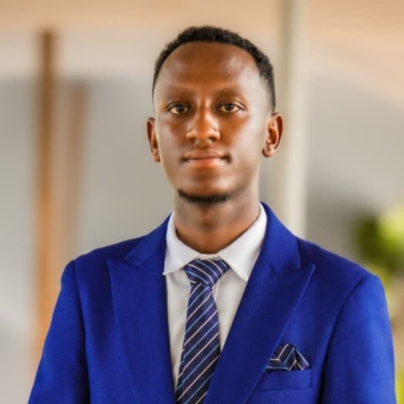 Portrait of Edwin Nambaje in a blue suit.